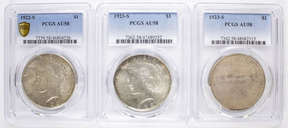 Three PCGS AU-58 Peace Dollars