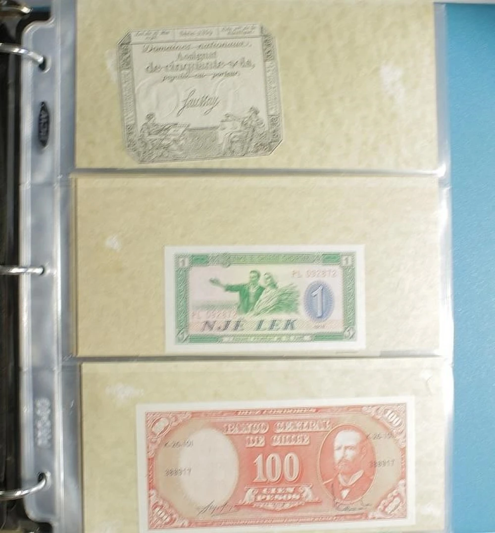 Binder of 125+ Pieces Of World Currency