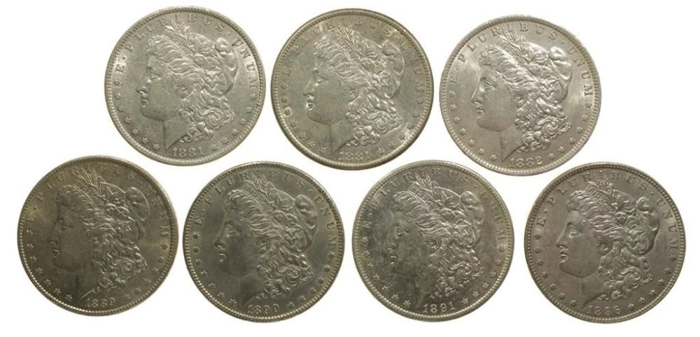 7 Different AU Morgan Dollars
