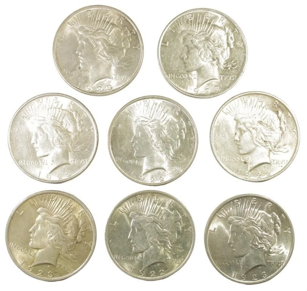 Eight Peace Dollars